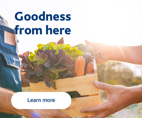Text Reading "Goodness from here. Click on learn more for reading." and an image of a food basket giving.