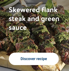 Skewered flank steak and green sauce